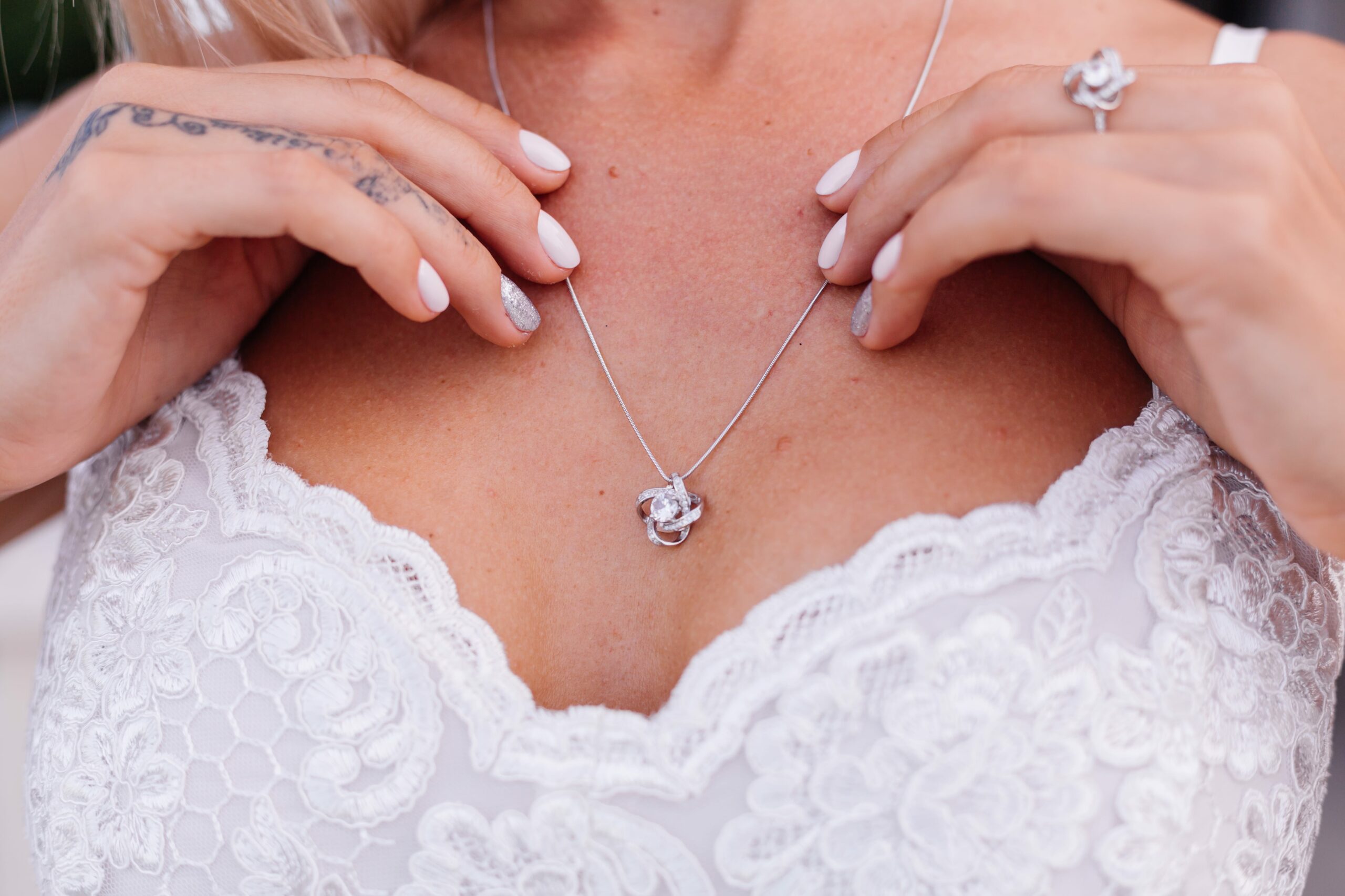 portrait-european-woman-wedding-dress-wearing-necklace-ring