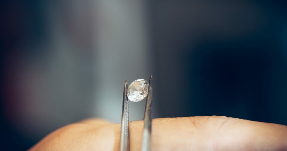 jeweler-holding-diamond-with-tweezers